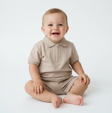 Load image into Gallery viewer, Baby boy in beige polo set - sitting