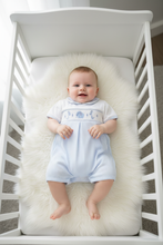 Load image into Gallery viewer, Baby boy in blue gingham elephant romper on fur rug, overhead shot