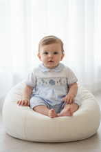 Load image into Gallery viewer, Baby boy in blue gingham elephant romper propped on white beanbag