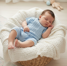Load image into Gallery viewer, Baby boy in blue knit set, round basket square
