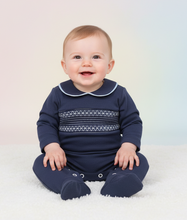 Load image into Gallery viewer, Baby boy in navy smocked babygrow - sitting pose