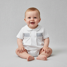 Load image into Gallery viewer, Baby boy in white smocked romper - bright studio
