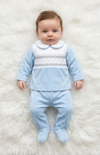 Load image into Gallery viewer, Baby boy lying on a white fluffy rug