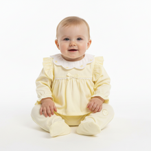 Load image into Gallery viewer, Baby girl in lemon yellow babygrow - white background