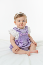 Load image into Gallery viewer, Baby girl in lilac romper