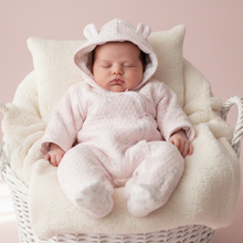 Load image into Gallery viewer, Baby girl in pink bear pramsuit - white basket front view