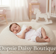 Load image into Gallery viewer, Baby girl in white romper on beanbag - full view