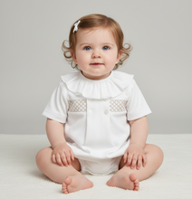 Load image into Gallery viewer, Baby girl in white romper - Upright neutral