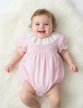 Load image into Gallery viewer, Baby girl lying on white fluffy rug