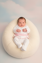 Load image into Gallery viewer, Baby girl on cream beanbag