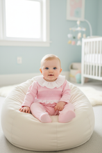Load image into Gallery viewer, Baby girl on cream beanbag