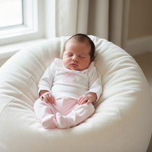 Load image into Gallery viewer, Baby girl on white beanbag
