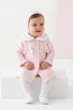 Load image into Gallery viewer, Baby girl seated on a white block with a soft blush studio background
