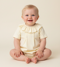 Load image into Gallery viewer, Baby girl sitting in lemon romper - Plain cream