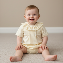 Load image into Gallery viewer, Baby girl sitting in lemon romper - Plain neutral