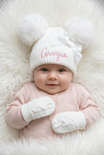 Load image into Gallery viewer, Baby in a pale pink outfit wearing personalised white hat and mittens