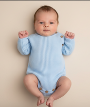 Load image into Gallery viewer, Baby in blue romper beige background