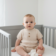 Load image into Gallery viewer, Baby in grey cot