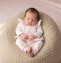Load image into Gallery viewer, Baby in pink sheep outfit - beige beanbag nestled
