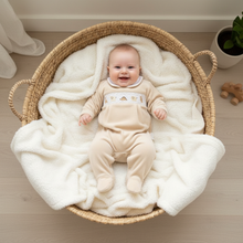 Load image into Gallery viewer, Baby in round rattan basket