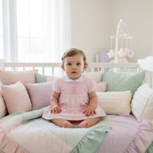 Load image into Gallery viewer, Baby in white crib