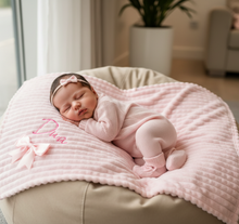 Load image into Gallery viewer, Baby on beige beanbag with pink Diva blanket