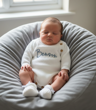 Load image into Gallery viewer, Baby propped on grey beanbag in white romper