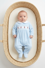 Load image into Gallery viewer, Baby wearing the blue soldier sleepsuit lying in a Moses basket