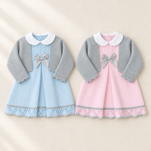 Load image into Gallery viewer, Blue and pink baby outfits on a warm ivory linen background