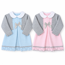Load image into Gallery viewer, Blue and pink baby outfits on a white studio background