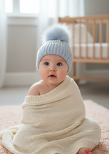Load image into Gallery viewer, Blue Pom Pom Hat on Baby Model