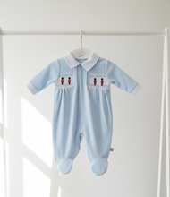 Load image into Gallery viewer, Close-up of blue soldier sleepsuit on hanger