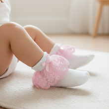 Load image into Gallery viewer, Close-up toddler cross-legged in pink bow socks