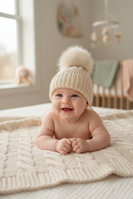 Load image into Gallery viewer, Cream Pom Pom Hat on Baby Model