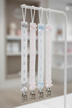 Load image into Gallery viewer, Four long dummy clips hanging on white hook