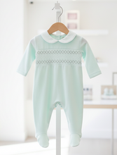 Load image into Gallery viewer, Mint Romper on Hanger in Shop Setting