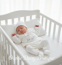 Load image into Gallery viewer, Newborn baby in crib wearing white knitted outfit
