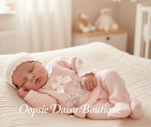 Load image into Gallery viewer, Newborn baby model wearing pink outfit with hat in nursery