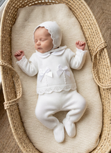 Load image into Gallery viewer, Newborn girl resting in a Moses basket on cream chunky knit wearing the white set