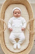 Load image into Gallery viewer, Newborn girl wearing the white knitted set in a Moses basket