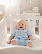 Load image into Gallery viewer, Newborn in blue romper - cot 2