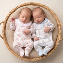 Load image into Gallery viewer, Newborn twins with eyes closed on a beige chunky blanket in a round basket