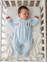 Load image into Gallery viewer, Overhead shot of baby in blue soldier sleepsuit