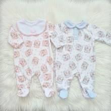 Load image into Gallery viewer, Pink and blue outfits laid side by side on a large white fluffy rug