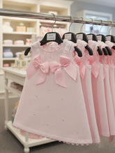 Load image into Gallery viewer, Pink dress on retail rail in baby shop