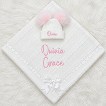 Load image into Gallery viewer, Pink Olivia Grace blanket and hat arranged on a white fluffy rug