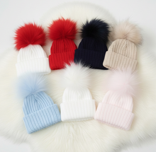 Load image into Gallery viewer, Pom pom hats on faux fur rug - minimal