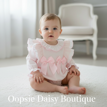 Load image into Gallery viewer, Real baby girl in pink romper with ruffled details