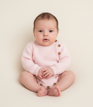 Load image into Gallery viewer, Sitting baby girl in pink romper