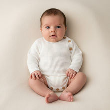 Load image into Gallery viewer, Sitting baby in white romper